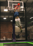 Guy Dunking Backwards on a Hoop